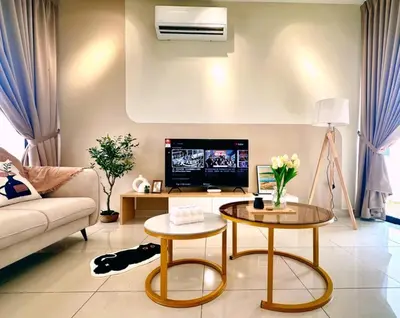 a living room with a couch and a tv at Modern Stylish 4BR Family House I Machang Bubuk in Bukit Mertajam