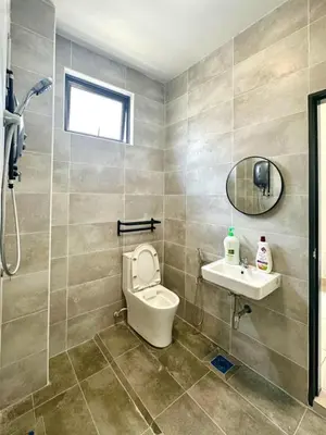 a bathroom with a toilet and a sink at Modern Stylish 4BR Family House I Machang Bubuk in Bukit Mertajam