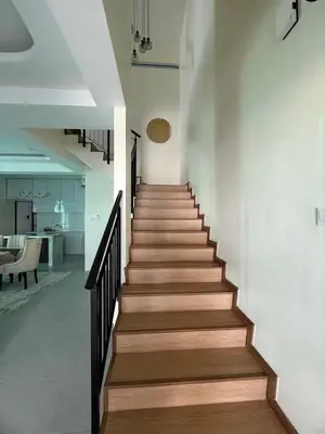 a staircase in a house with wooden floors at Villa SRC in Sungai Petani