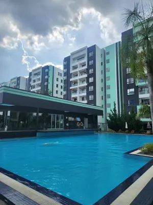 a large swimming pool in front of some buildings at Manhattan Condominium Ipoh in Ipoh