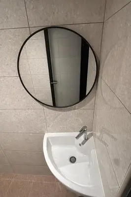 a bathroom with a sink and a mirror at M Spice Hotel Seberang Jaya in Perai