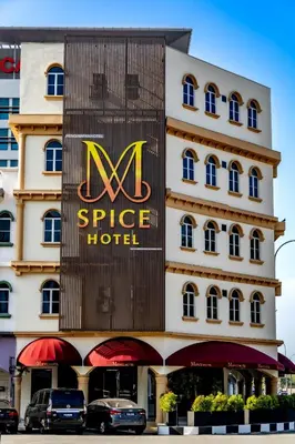 a hotel with a sign on the side of it at M Spice Hotel Seberang Jaya in Perai
