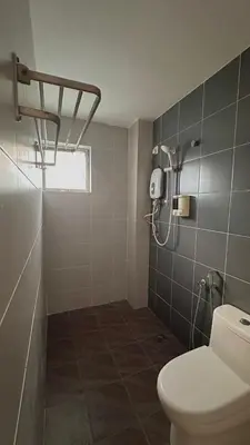 a bathroom with a toilet and a shower at C&CDreamland hotel in Ipoh