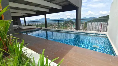 a swimming pool with a view of a building at Horizon Skyline Loft in Ipoh