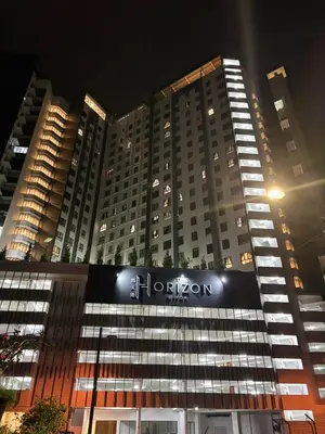 a large building with a sign on it at night at Horizon Skyline Loft in Ipoh