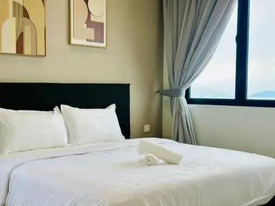 a bedroom with a white bed with a window at Breathtaking Sea View Penang Bridge 2BR in Bayan Lepas