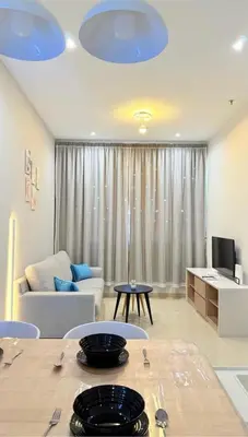 a living room with a couch and a table at Romantic Sea & Penang Bridge View Luxury 2BR in Bayan Lepas