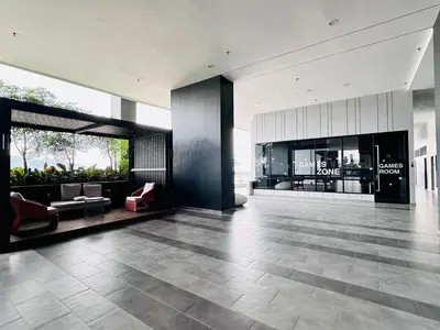 a lobby with couches and chairs in a building at High Floor Sea View Penang Bridge Luxury 2BR in Bayan Lepas