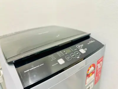 a microwave oven sitting on top of a machine at dream sweet home bayan lepas iconic netflix usm in Bayan Lepas