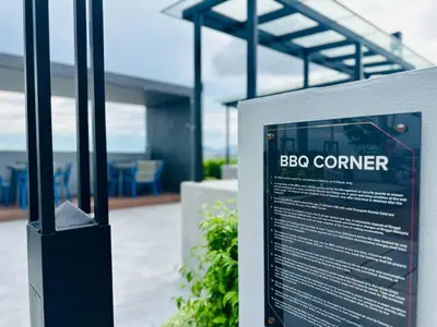 a sign in front of a building with a bbc corner at WOW! Sea & Penang Bridge View Infinity Pool 2BR in Bayan Lepas