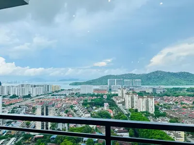 a view of a city from a balcony at WOW! Sea & Penang Bridge View Infinity Pool 2BR in Bayan Lepas
