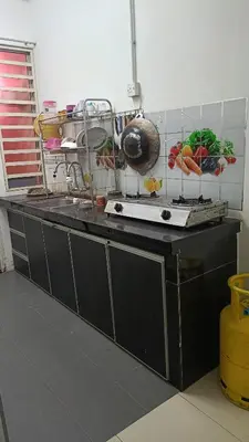 a kitchen with a counter top with fruits and vegetables at Homestay Kak Su Seri Iskandar in Seri Iskandar
