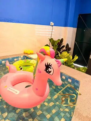 a pink toy unicorn in a pool in a bathroom at Ipoh Indoor Pool Homestay, BBQ Mahjong, 16 pax 4BR in Ipoh