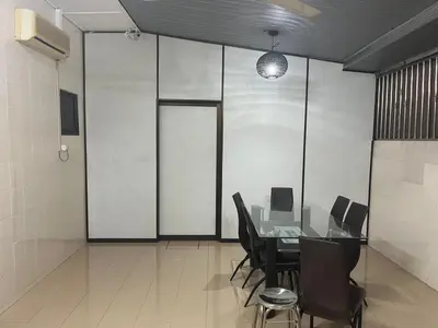 a conference room with a table and chairs in it at LIY Homestay in Gua Sai