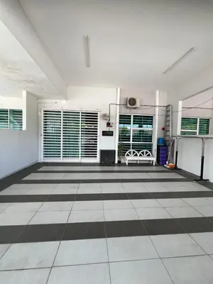 a large room with a black and white floor at Homestay Anisa Batu Gajah 4 Bilik in Batu Gajah