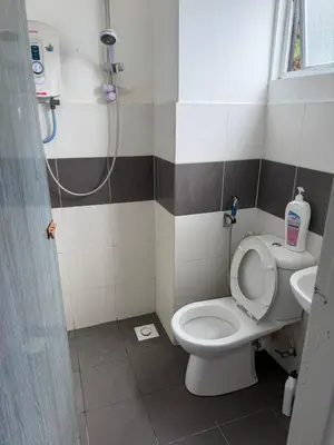a bathroom with a toilet and a shower at AYAAN RAFFLESIA Home at Cameron Highland in Tanah Rata