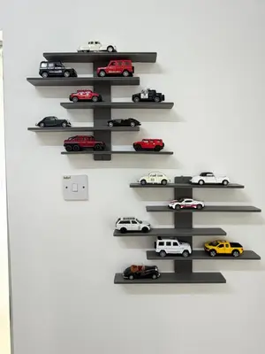 a wall with shelves with toy cars on them at AYAAN GAMING ARENA at Tanah Rata Cameron Highland in Tanah Rata