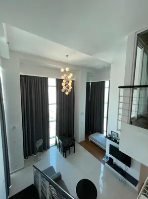 a large living room with a chandelier and a living room at Premier Suite at Maritime in George Town