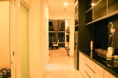 a kitchen with a view of a living room at Premier Suite at Maritime in George Town