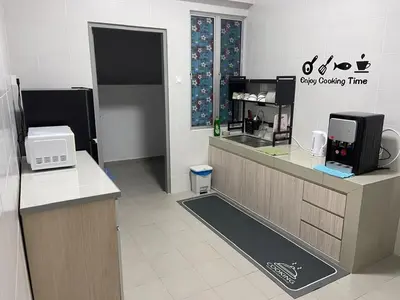 a coffee shop with a cash register and a counter at Peace HomestayThe Venus Sitiawan in Sitiawan