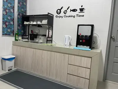 a kitchen with a counter with an ipod on it at Peace HomestayThe Venus Sitiawan in Sitiawan