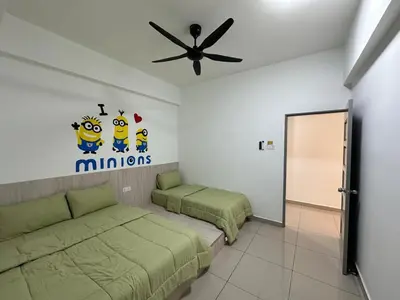 a bedroom with two beds and a ceiling fan at Peace HomestayThe Venus Sitiawan in Sitiawan