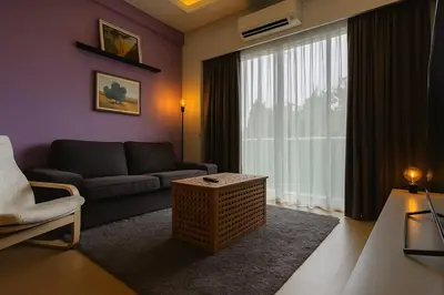 a living room with a couch and a window at Salam Comfy Suite at Bandar Meru Raya Ipoh in Ipoh