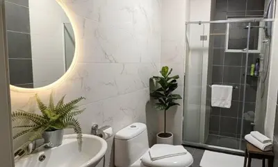 a bathroom with a toilet and a sink and a shower at Salam Comfy Suite at Bandar Meru Raya Ipoh in Ipoh