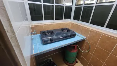 a radio sitting on a shelf in the corner of a bathroom at 9 Storey Apartment Next to Brinchang Centrum Night Market in Cameron Highlands