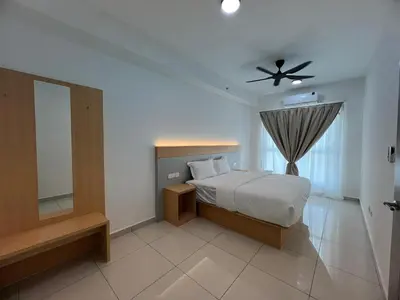 a bedroom with a bed and a ceiling fan at Icc ipoh y2 homestay in Ipoh