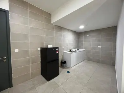 a bathroom with a black refrigerator and a sink at Icc ipoh y2 homestay in Ipoh