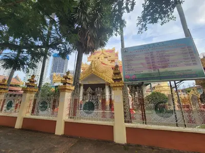a fence in front of a building with a sign at Gurney Vacation Gathering Comfy Home - Solok Burma in George Town
