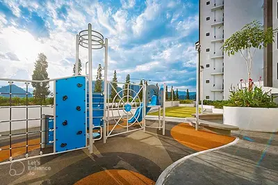 a playground in a building with a blue slide at Horizon Rooftop Skypool Condotel - Ipoh in Ipoh