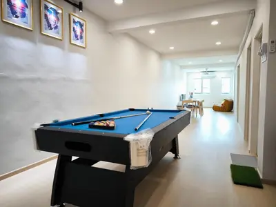 a living room with a pool table in a room at Taiping town area - 3 bedroom in Taiping