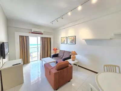 a living room with a couch and a table at Penang Rainbow Paradise in Tanjung Bungah