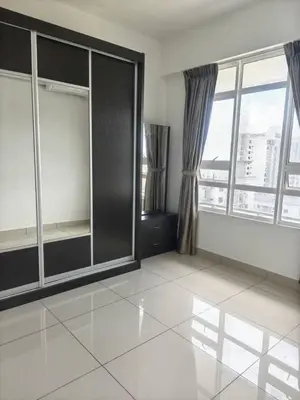 a large room with windows and a white tile floor at Rainbow Apartment by Renuka in Butterworth