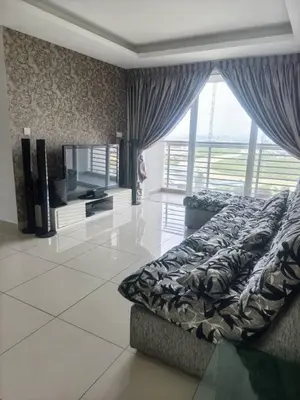 a bedroom with a bed and a large window at Rainbow Apartment by Renuka in Butterworth