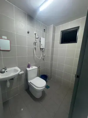 a bathroom with a toilet and a sink at Raub Colonial Homestay in Raub