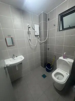 a bathroom with a toilet and a sink at Raub Colonial Homestay in Raub