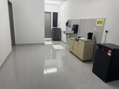 an empty room with a desk and a counter at Raub Colonial Homestay in Raub