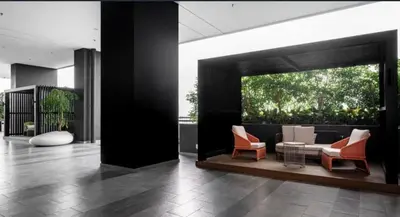 a living room with a couch and chairs in a building at Wanderlust Retreat 1R by Iconic Regency in Bayan Lepas