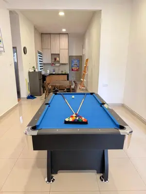 a pool table in the middle of a living room at Ayaan Snooker Home 5 at Quintet Apartment with Private Parking in Tanah Rata