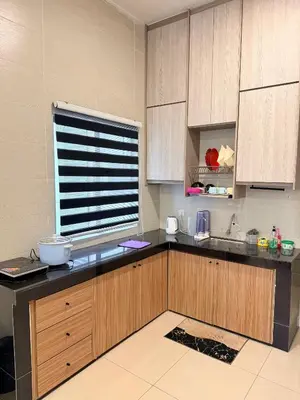 a kitchen with a counter with a sink and a window at Ayaan Snooker Home 5 at Quintet Apartment with Private Parking in Tanah Rata