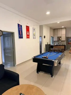 a living room with a pool table in it at Ayaan Snooker Home 5 at Quintet Apartment with Private Parking in Tanah Rata