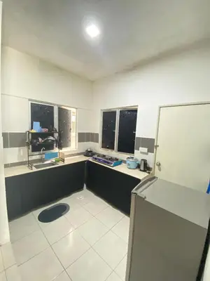 a room with a kitchen with two windows and a refrigerator at Rayyan'Homestay JAYA in Tanah Rata