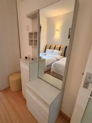 a mirror in a small room with a bed at The Nest Retreat, B7-3A-1 2BR Family Suite in Bukit Fraser