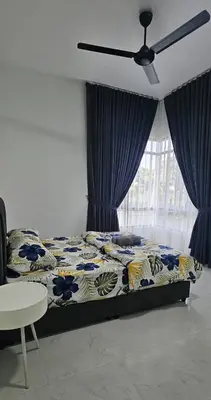 a bedroom with a bed and a ceiling fan at Seri Ipoh in Ipoh