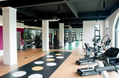 a gym with a bunch of treadmills and exercise bikes at Seri Ipoh in Ipoh