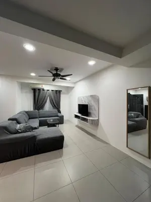 a living room with a bed and a tv at Classic Pearl Homestay in Teluk Intan
