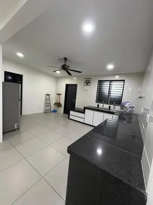 a large living room with a ceiling fan at Classic Pearl Homestay in Teluk Intan